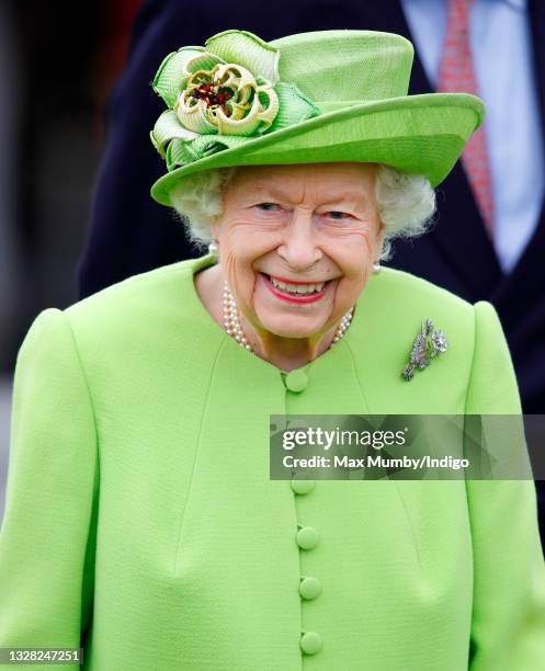 Queen Elizabeth II attends the Out-Sourcing Inc. Royal Windsor Cup polo match and a carriage driving display by the British Driving Society at Guards...