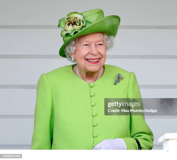 Queen Elizabeth II attends the Out-Sourcing Inc. Royal Windsor Cup polo match and a carriage driving display by the British Driving Society at Guards...