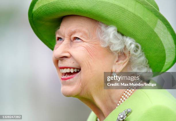 Queen Elizabeth II attends the Out-Sourcing Inc. Royal Windsor Cup polo match and a carriage driving display by the British Driving Society at Guards...