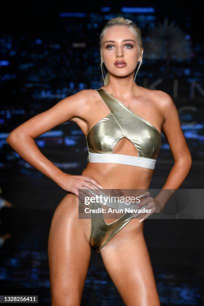 Karolina Derpienska walks the runway at the BIKINI BEACH AUSTRALIA Show during Miami Swim Week Powered By Art Hearts Fashion at Faena Forum on July...