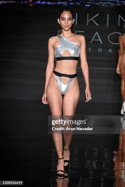 Model walks the runway at the BIKINI BEACH AUSTRALIA Show during Miami Swim Week Powered By Art Hearts Fashion at Faena Forum on July 11, 2021 in...