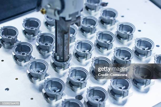 robot arm gripping machine parts - molding a shape stock pictures, royalty-free photos & images