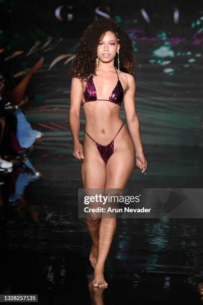 Model walks the runway at the GSaints Swimwear Show during Miami Swim Week Powered By Art Hearts Fashion at Faena Forum on July 11, 2021 in Miami...