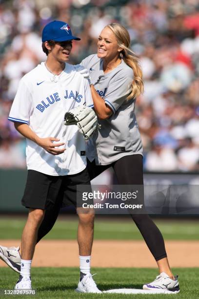 Social Media Influencer Josh Richards with Softball legend Jennie Finch during the MLB All-Star Celebrity Softball Game at Coors Field on July 11,...