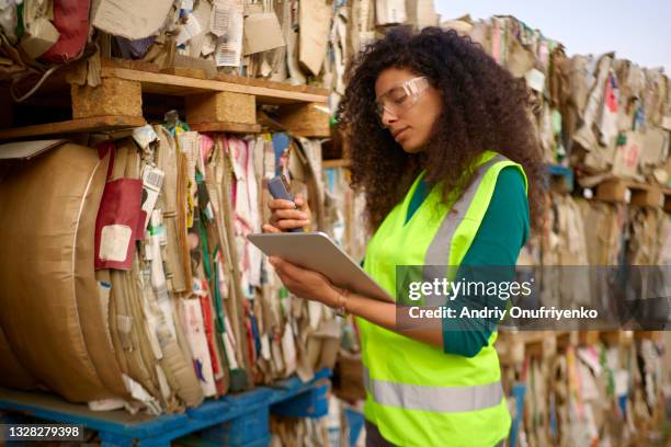 sustainable warehouse worker. - recycling stock pictures, royalty-free photos & images