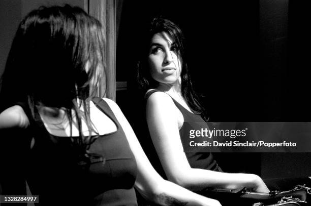 English singer Amy Winehouse posed backstage at the Jazz Cafe in Camden, London on 27th January 2004.