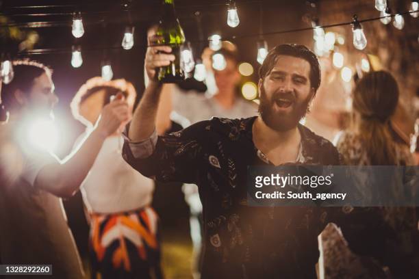 man on on party in back yard - drunk stockfoto's en -beelden