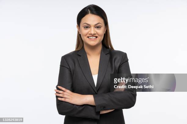 portrait of a young business women standing isolated over white background - indian corporate women background stockfoto's en -beelden