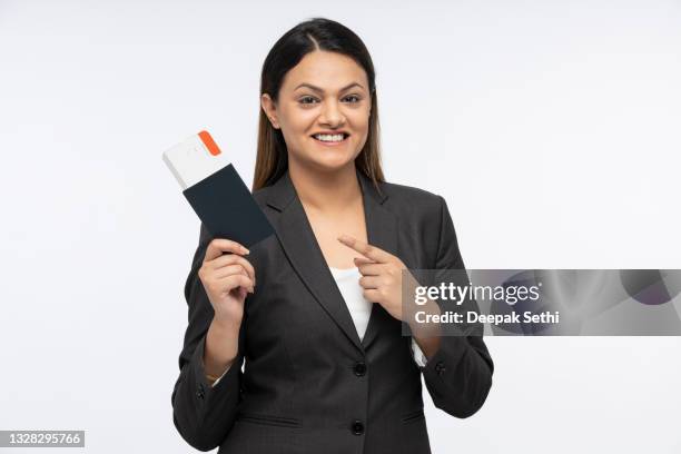 portrait of a young business women standing isolated over white background - indian corporate women background stockfoto's en -beelden