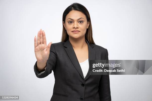 portrait of a young business women standing isolated over white background - indian corporate women background stockfoto's en -beelden