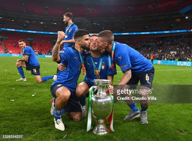 Lorenzo Insigne, Ciro Immobile and Marco Verratti of Italy celebrate with The Henri Delaunay Trophy following his team's victory in the UEFA Euro...