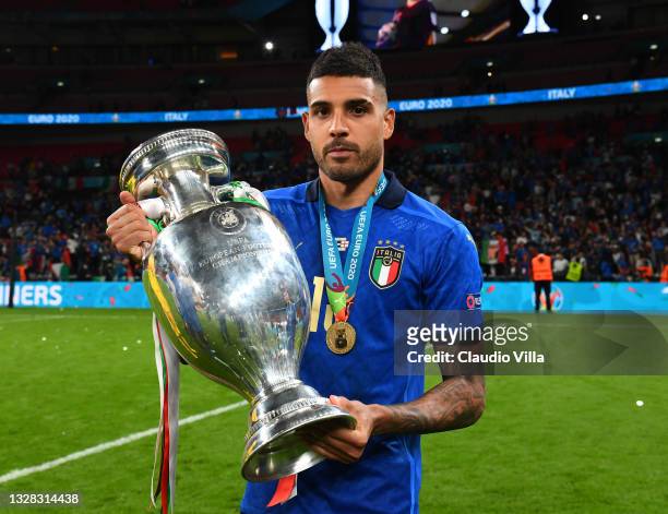 Emerson Palmieri of Italy celebrates with The Henri Delaunay Trophy following his team's victory in the UEFA Euro 2020 Championship Final between...