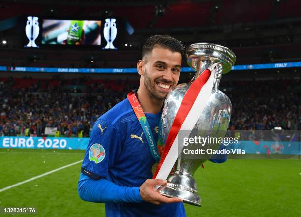 Leonardo Spinazzola kisses The Henri Delaunay Trophy following his team's victory in the UEFA Euro 2020 Championship Final between Italy and England...