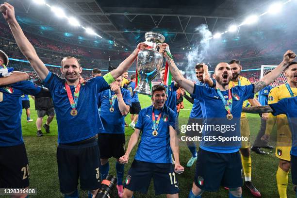 Leonardo Bonucci , Giorgio Chiellini and the complete team of Italy lift the Henri Delaunay Trophy following his team's victory in during the UEFA...