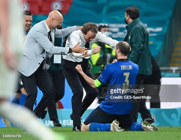 Giorgio Chiellini and head coach Roberto Mancini of Italy celebrate after victory in the UEFA Euro 2020 Championship Final between Italy and England...