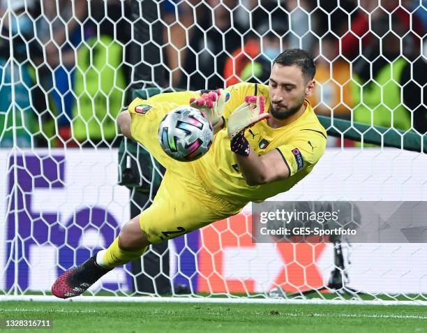 Gianluigi Donnarumma of Italy saves the game winning penalty of Bukayo Saka of England during the UEFA Euro 2020 Championship Final between Italy and...