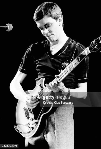 Bill Nelson of Bill Nelson's Red Noise performs on stage at Hammersmith Odeon, London, England, circa 1979. He is playing a Yamaha SG2000 guitar.
