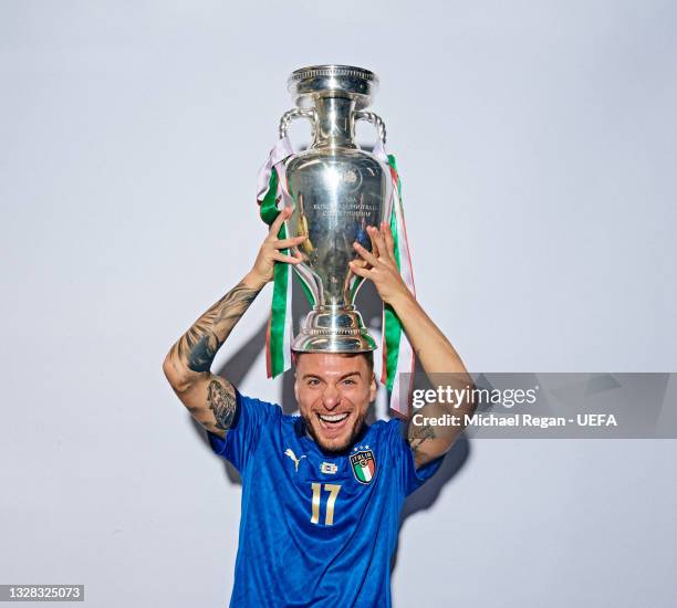 Ciro Immobile of Italy poses with The Henri Delaunay Trophy during an Italy Portrait Session following their side's victory in the UEFA Euro 2020...