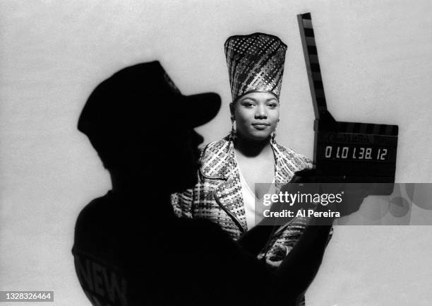 Queen Latifah appears with the film slate in the foreground on the set of music video shoot for "Fly Girl" on June 28, 1991 in New York City. .