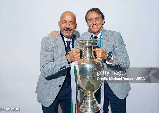 Gianluca Vialli, Delegation Chief of Italy and Roberto Mancini, Head Coach of Italy pose with The Henri Delaunay Trophy during an Italy Portrait...