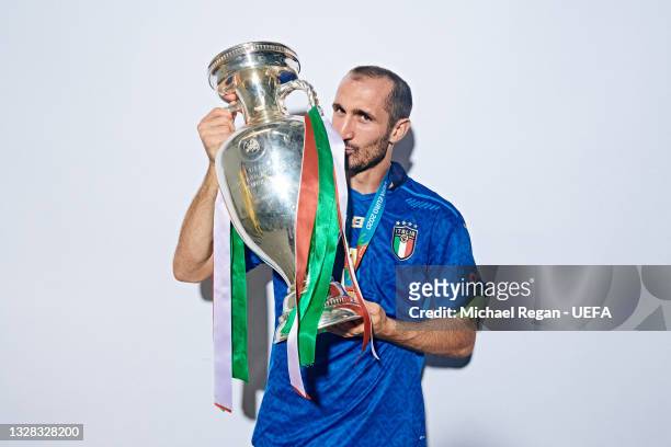 Giorgio Chiellini of Italy poses with The Henri Delaunay Trophy during an Italy Portrait Session following their side's victory in the UEFA Euro 2020...