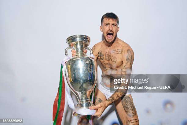 Francesco Acerbi of Italy poses with The Henri Delaunay Trophy during an Italy Portrait Session following their side's victory in the UEFA Euro 2020...