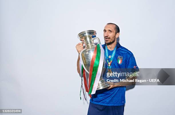 Giorgio Chiellini of Italy poses with The Henri Delaunay Trophy during an Italy Portrait Session following their side's victory in the UEFA Euro 2020...