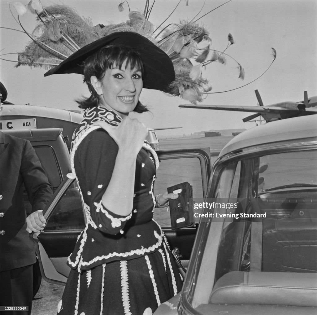Alan Cogan English pop singer Alma Cogan wears a Pearly Queen costume as she ...