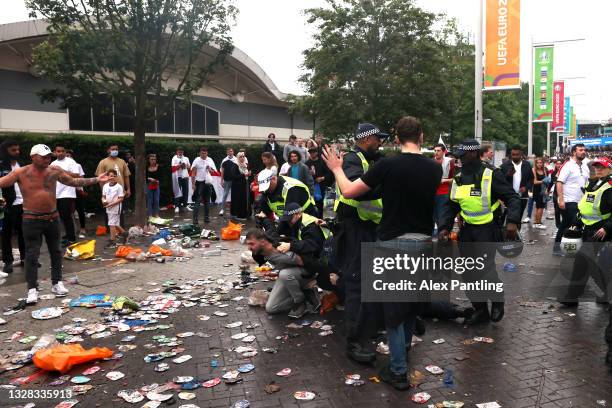 Police break up a fight during the UEFA Euro 2020 Championship Final between Italy and England at Wembley Stadium on July 11, 2021 in London, England.