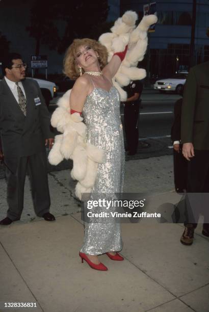 Puerto Rican actress Holly Woodlawn , a Warhol superstar, attends the premiere of the film 'I Shot Andy Warhol' at the Cinerama Dome Theater in...