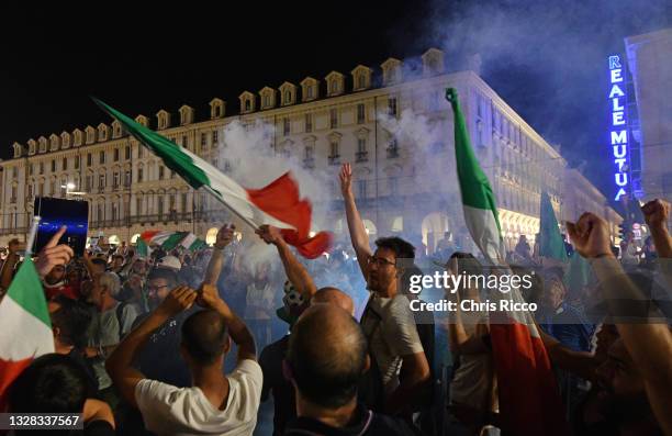 Italian fans celebrate Italy winning the UEFA Euro 2020 on July 11, 2021 in Turin, Italy. Italy's national football team remain unbeaten in their...
