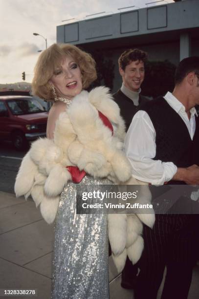 Puerto Rican actress Holly Woodlawn , a Warhol superstar, attends the premiere of the film 'I Shot Andy Warhol' at the Cinerama Dome Theater in...