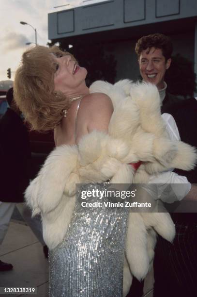 Puerto Rican actress Holly Woodlawn , a Warhol superstar, attends the premiere of the film 'I Shot Andy Warhol' at the Cinerama Dome Theater in...