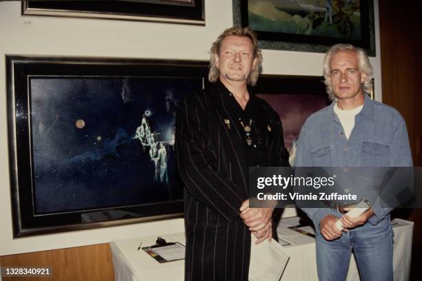 English singer and musician Chris Squire and keyboardist Tony Kaye of progressive rock band Yes at an art exhibition, USA, circa 1995.