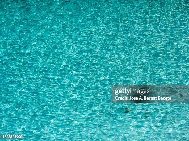 full frame of elevated view of the transparent water of a beach on the island of majorca. - running water bath stock pictures, royalty-free photos & images