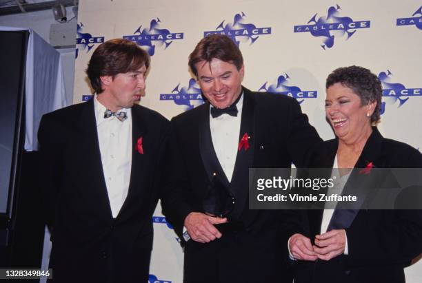 From left to right, Ron Reagan Jr., the son of US President Ronald Reagan, American actor Robert Urich and journalist Linda Ellerbee at the 14th...