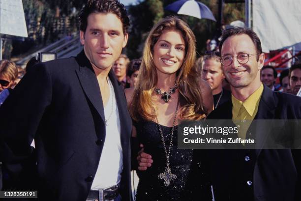 American fashion photographer Herb Ritts with supermodel Cindy Crawford and real estate agent Chris Cortazzo at the MTV Video Music Awards at the...