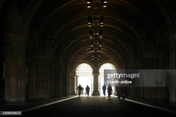 bicycle pass and tunnel of the rijksmuseum - rijksmuseum stock pictures, royalty-free photos & images