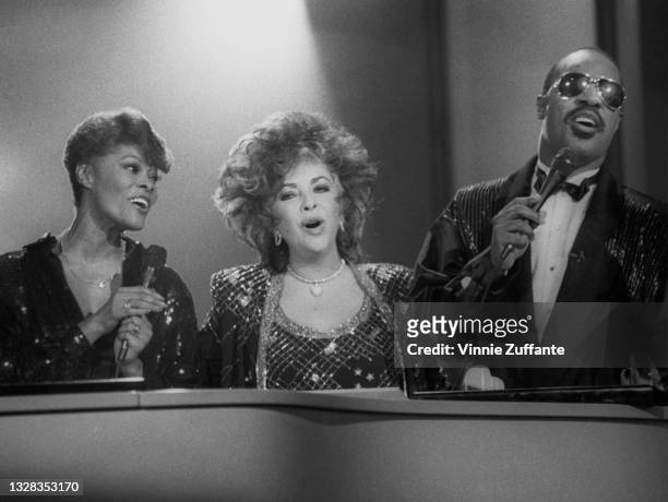 From left to right, Dionne Warwick, Elizabeth Taylor and Stevie perform the song 'That's What Friends Are For' on the television show 'Solid Gold' in...