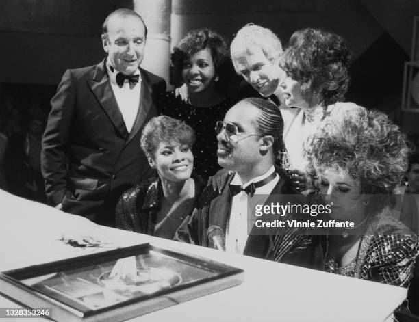 Dionne Warwick, Stevie Wonder, Elizabeth Taylor, Gladys Knight, Burt Bacharach and Carole Bayer Sager at a performance of the song 'That's What...