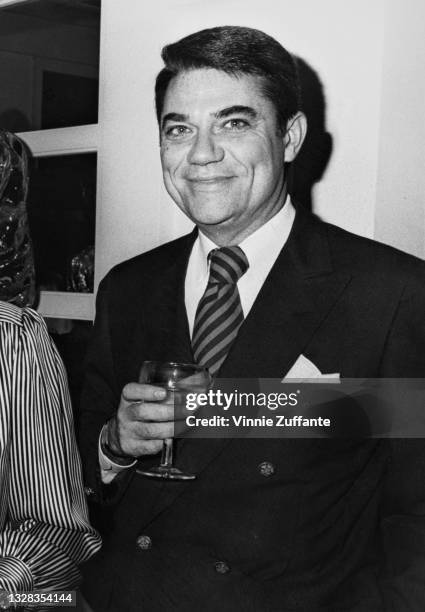 American film critic Rex Reed attends a party for the launch of his book 'Personal Effects' in New York City, USA, 1986.