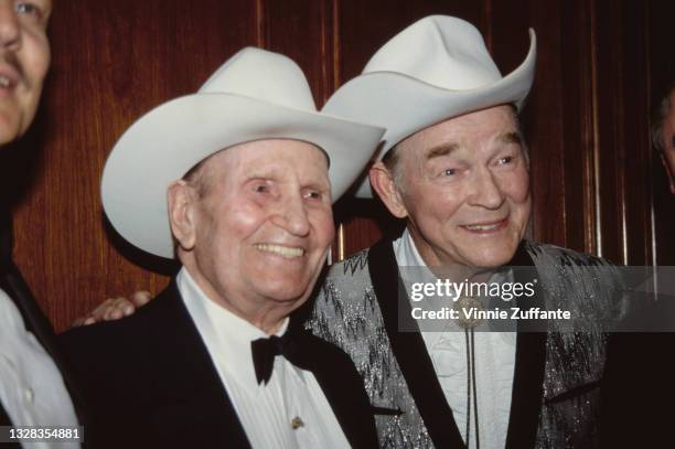 American singers and actors Roy Rogers and Gene Autry at a press conference held by Autry at the Century Plaza Hotel in Century City, Los Angeles,...