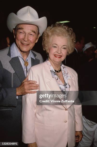 American singer and actor Roy Rogers and his wife Dale Evans attend a pre-Oscar party before the 61st Annual Academy Awards, at the Shrine Auditorium...