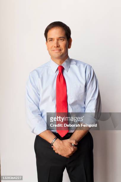 Deborah Feingold/Corbis via Getty Images) Portrait of American politician and US Senator Marco Rubio as he poses against a white background, New...
