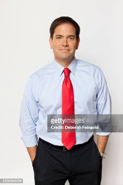 Deborah Feingold/Corbis via Getty Images) Portrait of American politician and US Senator Marco Rubio as he poses against a white background, New...