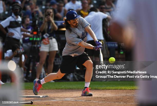Steve Aoki a musician hits the ball during the MLB All-Star celebrity softball game at Coors Field on July 11, 2021 in Denver, Colorado.