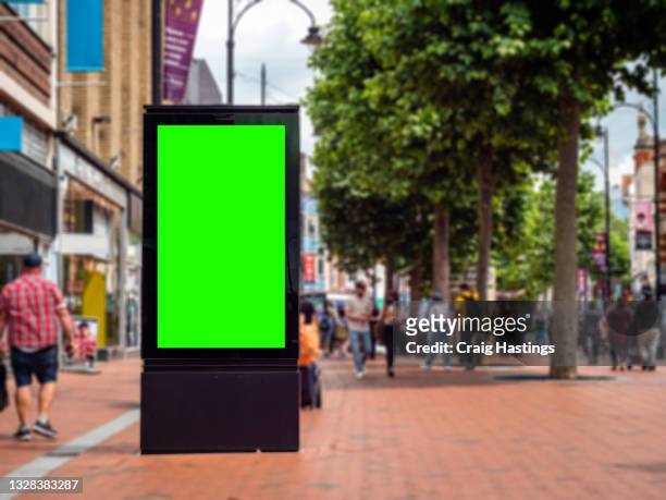 european city centre shopping retail high street with advertising billboard green screen. chromakey with copy space - london billboard fotografías e imágenes de stock