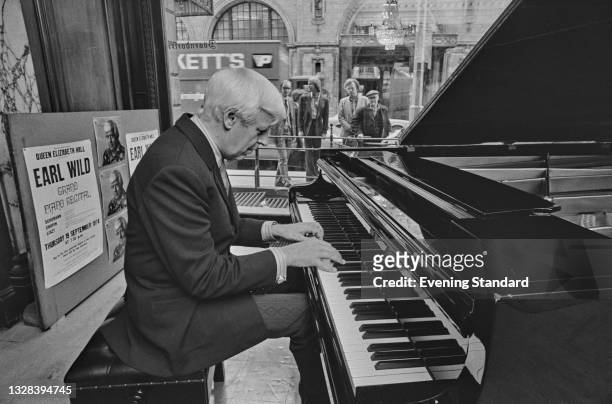 American pianist Earl Wild performs at a Bosendorfer piano showroom in London, UK, 18th September 1974. He will be performing at the Queen Elizabeth...
