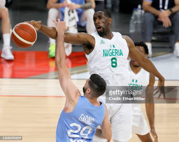Ekpe Udoh of Nigeria blocks a shot by Patricio Garino of Argentina during an exhibition game at Michelob ULTRA Arena ahead of the Tokyo Olympic Games...