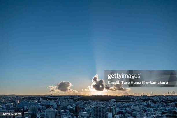 morning sunbeam on the residential district in okinawa of japan - sunrise ストックフォトと画像